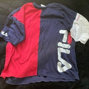 A worn half color Fila shirt